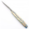Couteau Laguiole 12cm plein en mammouth zébré incus dans résine bleue